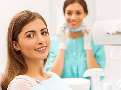 adult woman with braces at dentist office